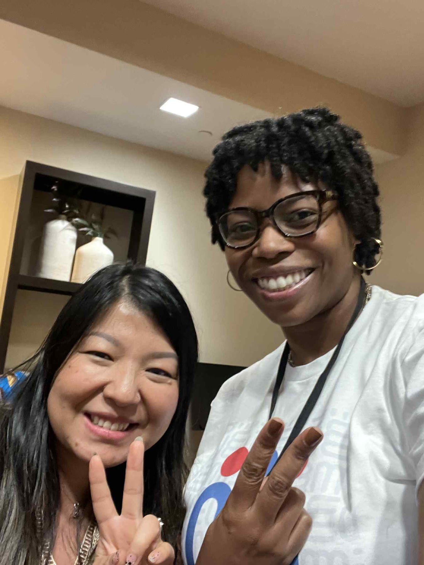 Two smiling workshop participants taking a photo together