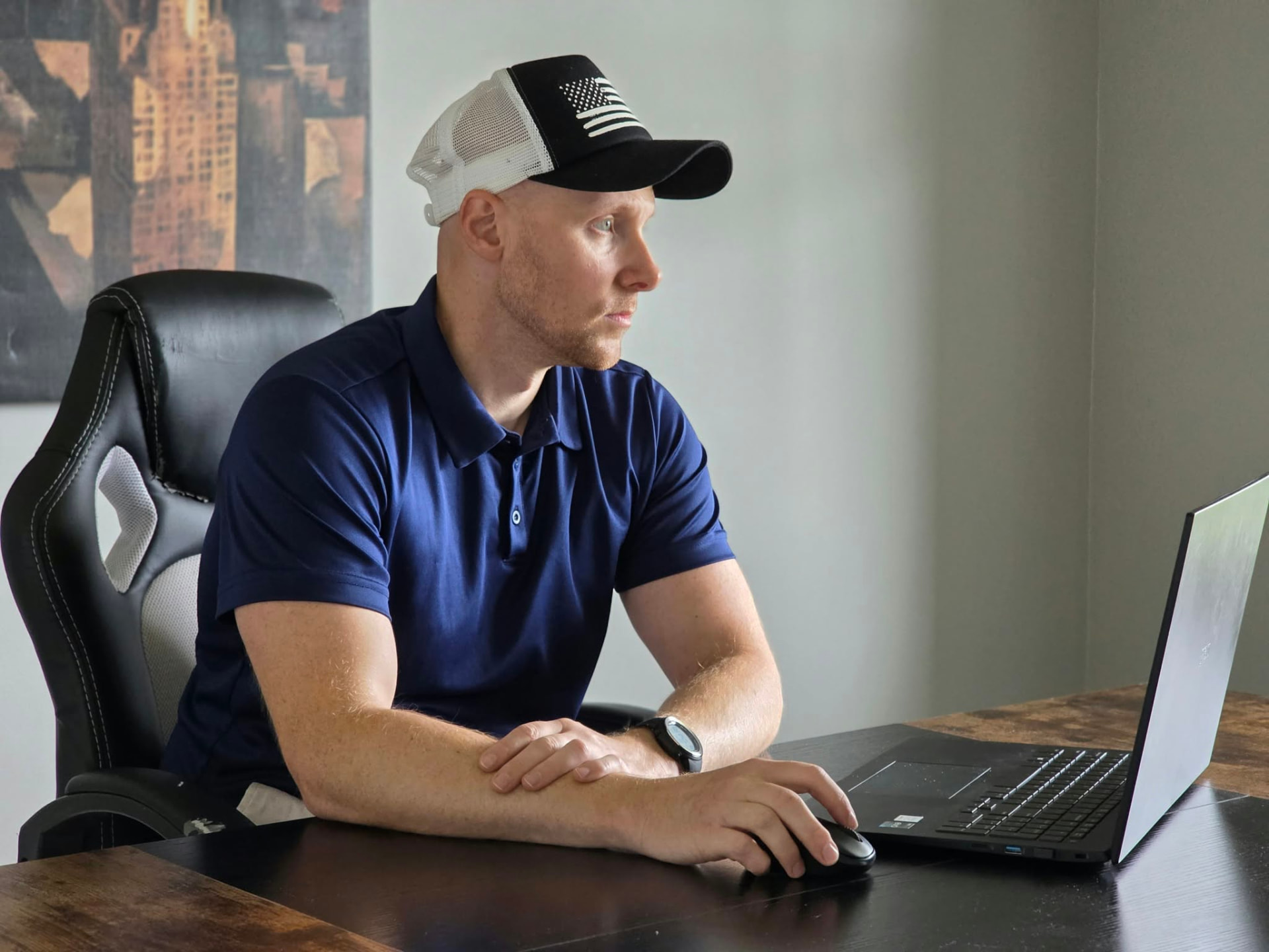 Derek James working at his desk