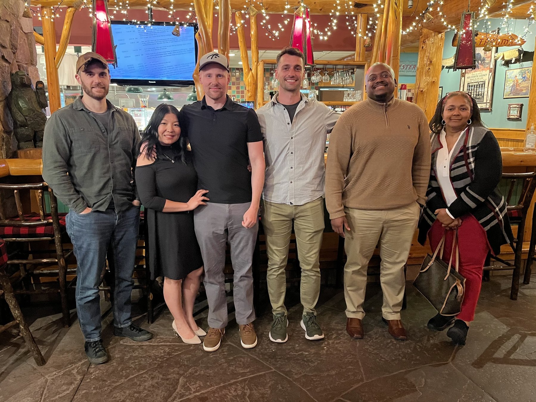 Derek James and workshop participants gathered at a restaurant